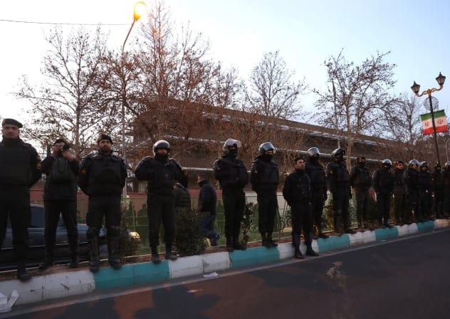  Members of the Iranian police stand guard at a protest in front of the British embassy following anti-government protests in Tehran, Iran, January 14, 2026.