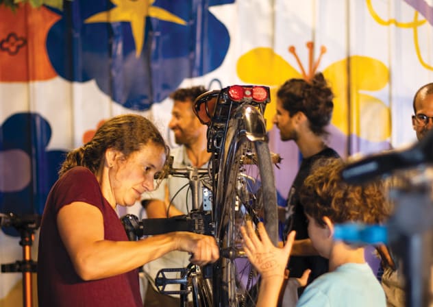 Pnimeet volunteers help Jerusalemite cyclists keep their own wheels turning.