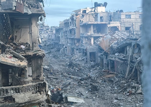 Palestinian houses stand badly damaged during the ongoing Israeli military operation, amid Israel-Hamas conflict, in Beit Lahiya, in the northern Gaza Strip, December 18, 2024. 