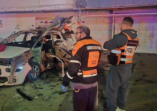 United Hatzalah emergency responders look on in the aftermath of a vehicle explosion in Kiryat Yam, near Haifa, February 4, 2026.