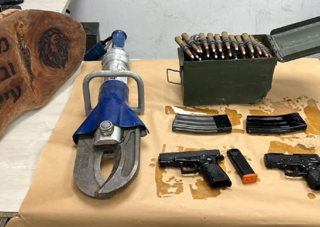 Two handguns, an explosive device, ammunition, and magazines seized from a school compound in Lakiya, Feb 4, 2026.