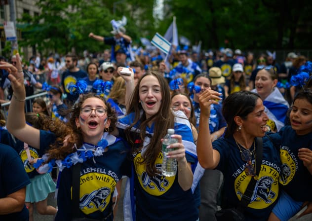 Participants cheer and dance during the Celebrate Israel Parade up Fifth Avenue on May 18, 2025 in New York City.