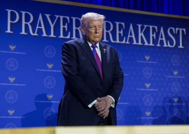US President Donald Trump prays during a group prayer during the National Prayer Breakfast in Washington, DC, US, February 5, 2026.