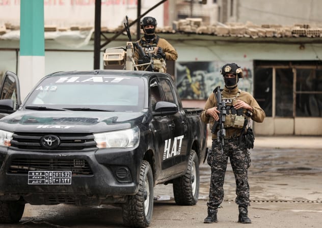 Members of the Kurdish Internal Security Forces wait for the arrival of the security forces of the Syrian government during the curfew, following an agreement between the Syrian Democratic Forces and the Syrian government, in Qamishli, Syria, February 3, 2026.