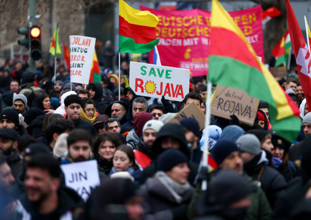 Members of the Kurdish community and other protesters attend a demonstration against recent military clashes between the Syrian army and Kurdish forces, in Berlin, Germany, January 24, 2026.