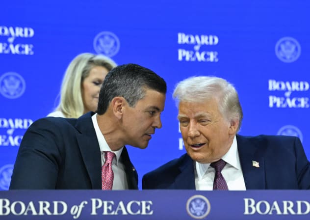 Paraguay’s President Santiago Pena (L) speaks with US President Donald Trump at the Board of Peace meeting during the World Economic Forum (WEF) annual meeting in Davos, Switzerland, on January 22, 2026. 