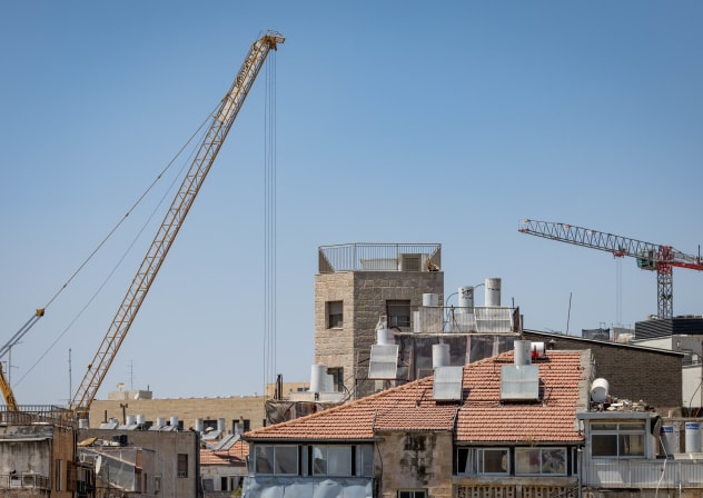 Cranes working at a construction site in Jerusalem, June 12, 2025
