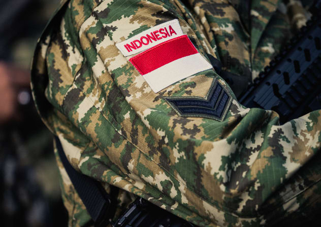 A patch with Indonesia and an Indonesian flag on the arm of an Indonesian soldier during the preparation of the annual Bastille Day military parade on the Champs Elysees avenue in Paris France on July 14, 2025. 