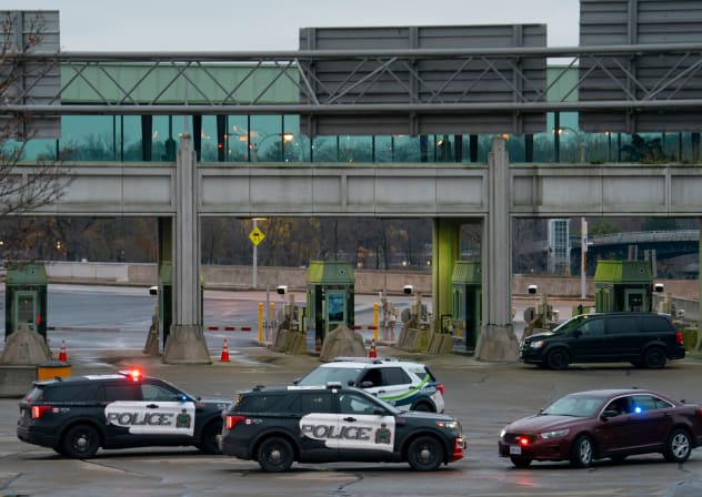 Canadian police cars are seen near the Rainbow Bridge border crossing into the US in Niagara Falls, Ontario on November 22, 2023.