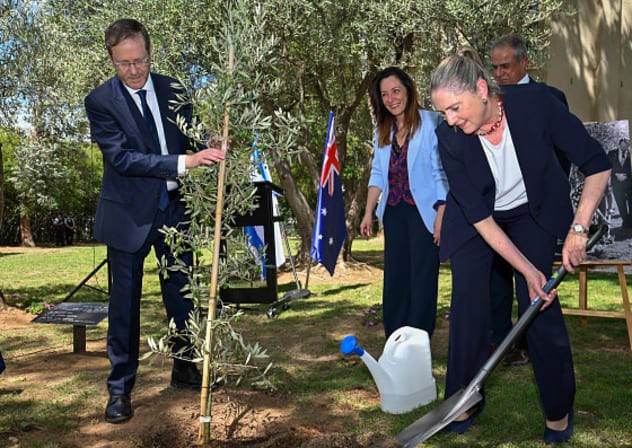  Israel's President Isaac Herzog and the First Lady Michal Herzog plant an olive tree in the gardens at the Embassy of Israel on February 11, 2026 in Canberra, Australia. 
