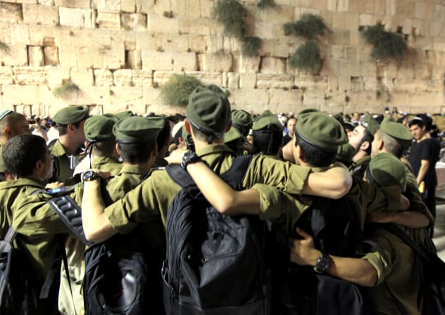 Soldiers praying at the Kotel in 2013. 