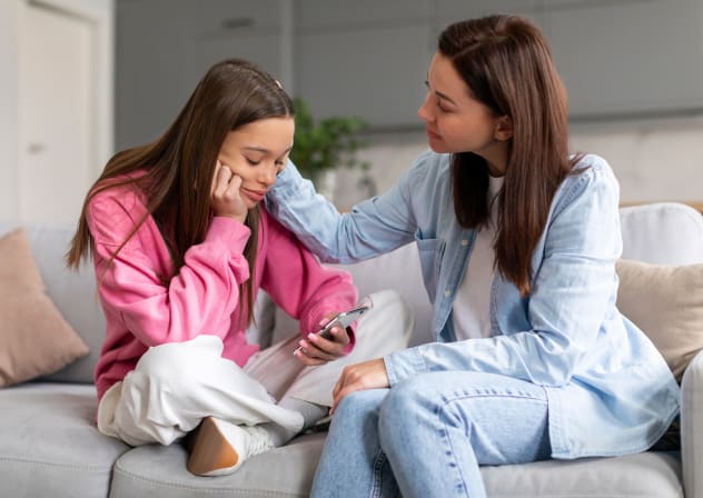 An illustrative image of a supportive mother talking to her child.