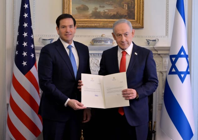 Prime Minister Benjamin Netanyahu and US Secretary of State Marco Rubio hold up the Gaza Board of Peace charter on Febuary 11, 2026. 