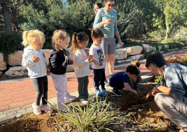 Dutch volunteers plant tulips with children in November, in the agricultural community of Mivtachim along the Gaza border.