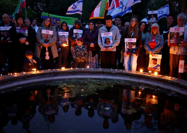 MEMBERS OF the Hostages and Missing Families Forum hold a vigil in London for the one-year anniversary of the October 7 massacre, on October 7, 2024,