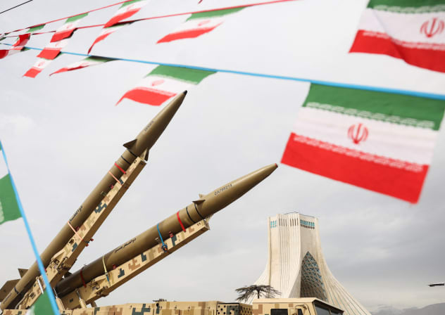 Bunting of Iranian flags next to missiles on display, with Azadi Tower in the background, during the 47th anniversary of the Islamic Revolution in Tehran, Iran February 11, 2026
