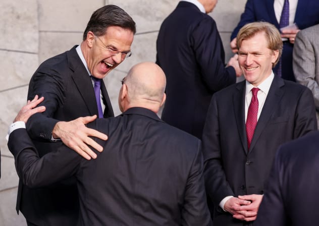 NATO Secretary General Mark Rutte speaks with Greece's Defencee Minister Nikolaos Dendias next to US Undersecretary of Defence for Policy Elbridge Colby as they take part in a family photo with NATO Defence Ministers at the Alliance headquarters in Brussels, Belgium February 12, 2026. 