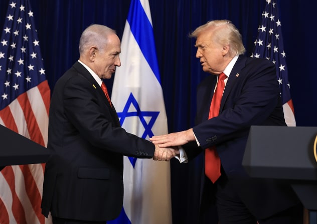 US President Donald Trump shakes hands with Israeli Prime Minister Benjamin Netanyahu during a press conference at his Mar-a-Lago club on December 29, 2025 in Palm Beach, Florida. 
