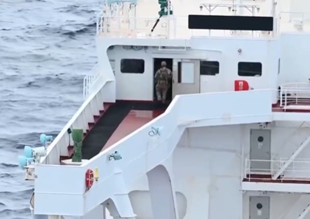 US troops are seen boarding an oil tanker breaching Washington's blockade on sanctioned vessels traveling to or from Venezuela, February 15, 2026.
