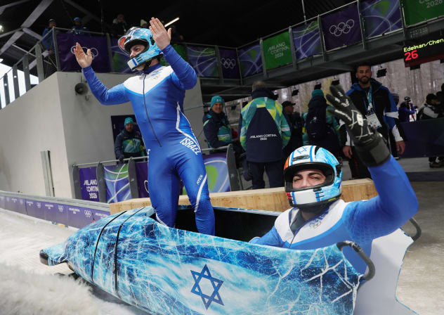 Adam Edelman of Israel and Menachem Chen of Israel's bobsleigh team react after their run, at the Milano Cortina 2026 Olympics, in Italy, on February 16, 2026..