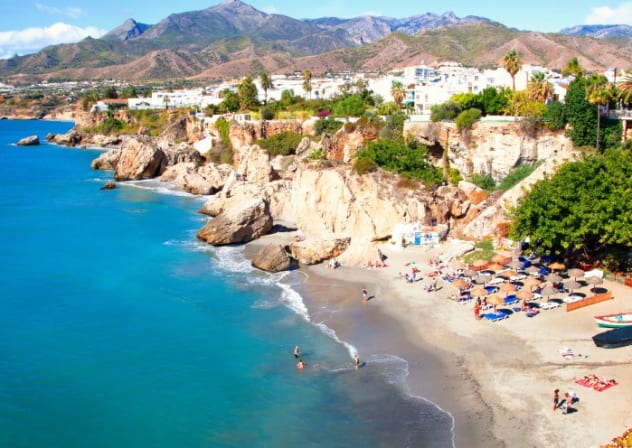 Tourism on the beach in the city of Nerja, Málaga.