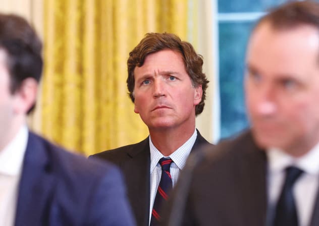 Tucker Carlson looks on during US President Donald Trump’s meeting with oil  industry executives, at the White House in Washington, Jan. 9.