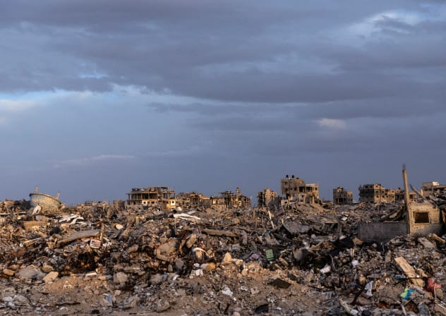 Buildings lie in ruins amidst the rubble in Rafah, in the southern Gaza Strip, on December 8, 2025.