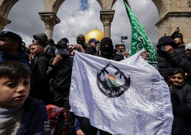 PALESTINIANS anti-Israel slogans and lift flags during a demonstration at the Temple Mount’s al-Aqsa Mosque complex, in 2023.