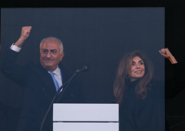 ‘A CROWNING moment’: Iran’s former crown prince and now key opposition figure Reza Pahlavi clenches his fist as he stands on stage next to his wife, Yasmine Pahlavi, during a demonstration of the Iranian opposition on February 14 in Munich, on the sidelines of the 62nd Munich Security Conference.