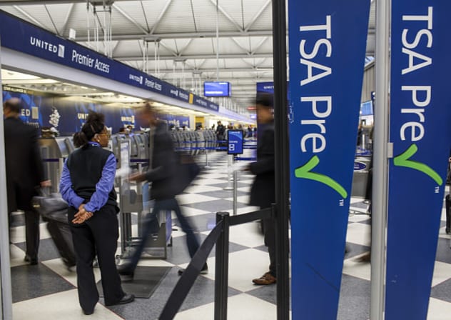 Passengers walk through the entrance of a TSA PreCheck in Terminal One at O'Hare International Airport on Feb. 1, 2017, in Chicago.
