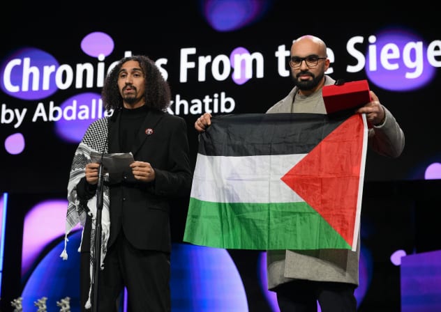Palestinian director Abdallah Alkhatib (L) and Algerian producer Taqiyeddine Issaad accept the GWFF Best Feature Film Debut Award for "Chronicles From the Siege" during the Award Ceremony of the 76th Berlinale on February 21, 2026.