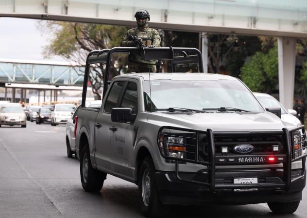 A member of the Mexican navy patrols Benito Juarez International Airport after Mexican drug lord Nemesio Oseguera, known as "El Mencho," was killed in Jalisco state, in Mexico City, Mexico, February 22, 2026.