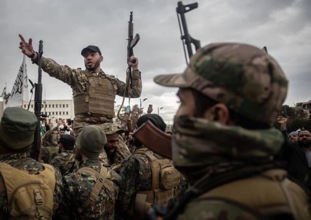 Soldiers from Hay’at at Tahrir al-Sham (HTS), a prominent Sunni Islamist militant group and political organization formerly affiliated with al-Qaeda, hold a demonstration in Damascus, Syria.