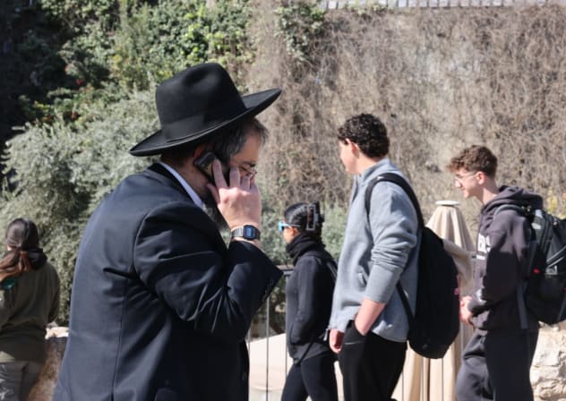 A haredi man speaking on his kosher phone in Jerusalem on February 23, 2026. 
