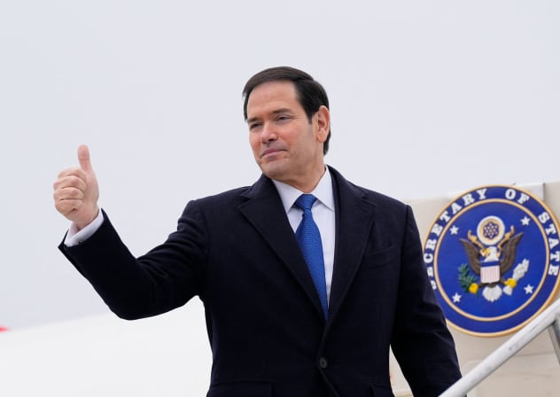 US Secretary of State Marco Rubio gives a thumbs up as he departs at the Liszt Ferenc International Airport in Budapest, Hungary, February 16, 2026.