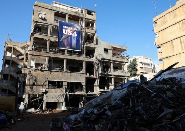 A banner that reads 'Made in USA' hangs on a damaged building in the Chiyah district of Beirut's southern suburbs, Lebanon, November 28, 2024