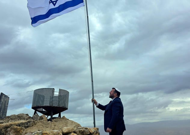 An Israeli flag is raised on the peak of Mount Sartaba in the Jordan Valley, February 23, 2026.