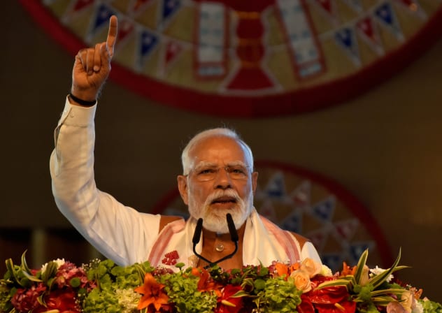 India's Prime Minister Narendra Modi addresses his supporters after he inaugurated a new terminal building of Lokpriya Gopinath Bordoloi International Airport in Guwahati, India, December 20, 2025.