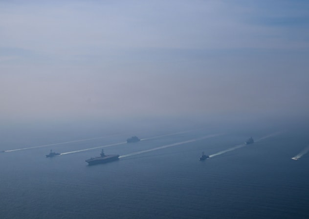 The USS Abraham Lincoln Carrier Strike Group sails in formation in the Arabian Sea, Feb. 6, 2026. 