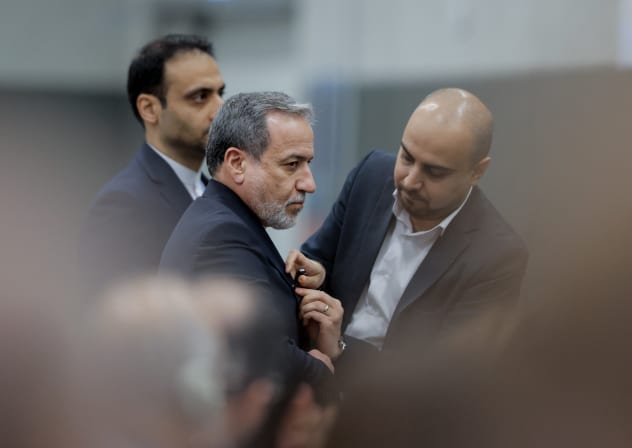 Iran's Foreign Minister Abbas Araghchi (C) looks on prior to delivering a speech during a session of the UN Conference on Disarmament, on the sideline of a second round of US-Iranian talks with Washington pushing Tehran to make a deal to limit its nuclear programme, in Geneva, on February 17, 2026.