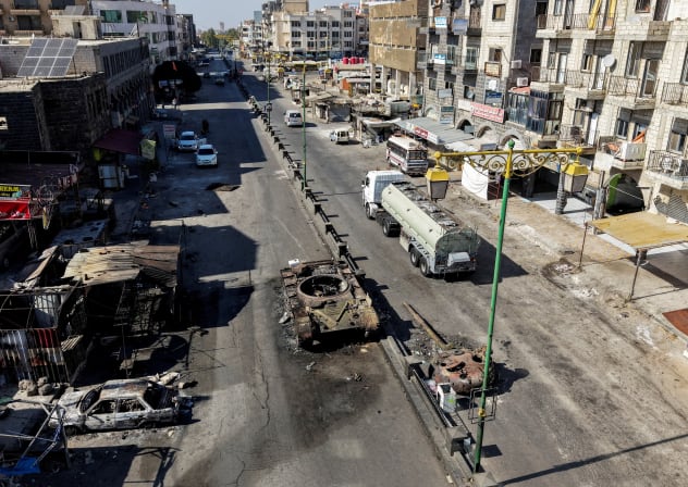 A drone view shows the remains of a destroyed tank, following deadly clashes between Druze fighters, Sunni Bedouin tribes and government forces, in Syria's predominantly Druze city of Sweida, Syria July 25, 2025.