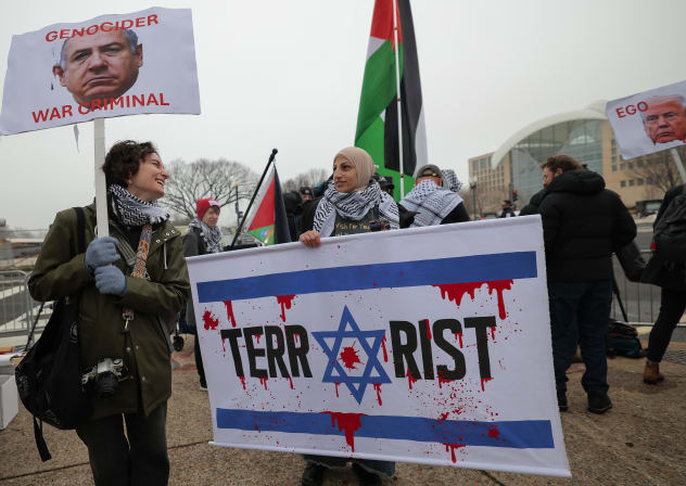 Anti-Trump and pro-Palestine protesters gather outside the Donald J. Trump Institute of Peace on February 19, 2026 in Washington, DC.