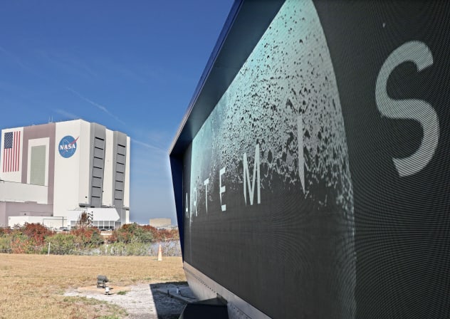 The countdown clock for the launch of NASA's Artemis II Space Launch System (SLS) rocket is seen near the massive Vehicle Assembly building at Kennedy Space Center in Cape Canaveral, Florida, on February 20, 2026.