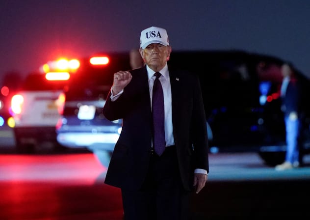 US President Donald Trump pumps his fist after disembarking Air Force One at Palm Beach International Airport in West Palm Beach, Florida, US, February 27, 2026