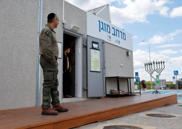 An Israeli security personnel stands by a protected area after missiles were launched towards Israel from Iran following strikes by Israel and the US on Iran, in Latrun, Israel, February 28, 2026.