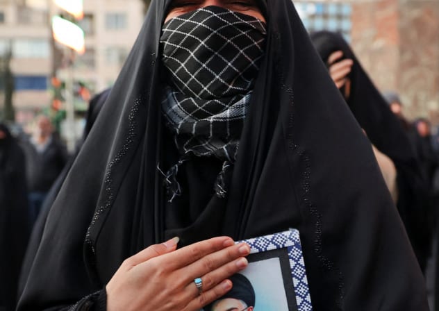 A WOMAN reacts as people gather at the Enghelab Square, after Iran's Supreme Leader Ayatollah Ali Khamenei was killed in Israeli and US strikes on Saturday, in Tehran, Iran, March 1, 2026.