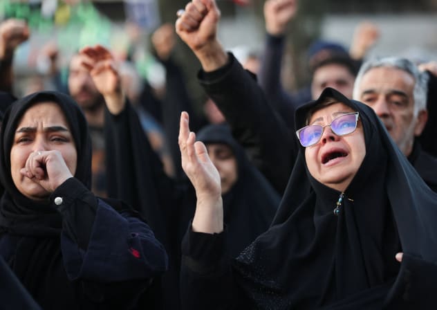 People react as they gather at the Enghelab Square, after Iran's Supreme Leader Ayatollah Ali Khamenei was killed in Israeli and US strikes on Saturday, in Tehran, Iran, March 1, 2026.