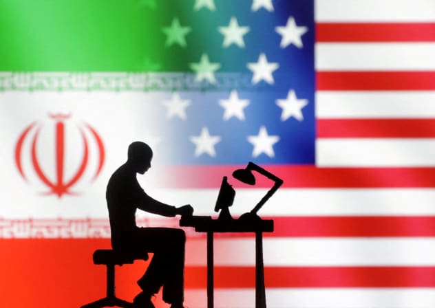 FILE PHOTO: Figurines with computers are seen in front of US and Iran flags in this illustration taken, September 10, 2022. 