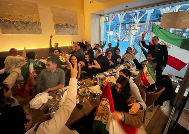 Customers celebrate the death of Iran's Supreme Leader Ayatollah Ali Khamenei at Ravagh Persian Grill restaurant in Midtown on Sunday, March 1, 2026, in New York City. 