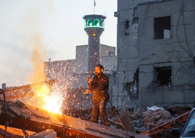 A man works amid debris, following an Israeli and U.S. strike on a police station, amid the U.S.-Israel conflict with Iran, in Tehran, Iran, March 2, 2026